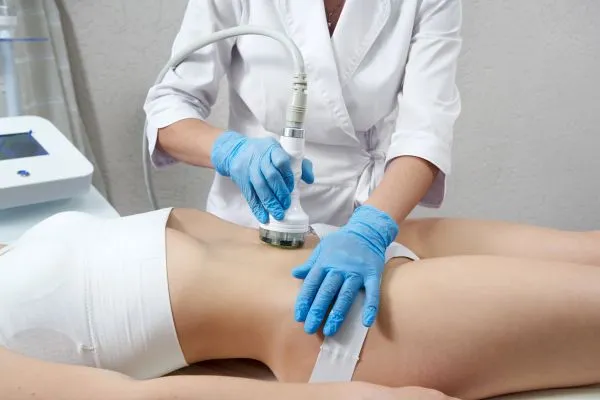 Lost the Weight but Not the Loose Skin? 2 woman having HIFU treatment on her stomach to combat loose skin Hatfield following weight loss